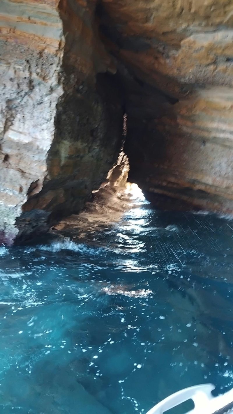 Bastien at the helm of O2 Mer, in the Calanques